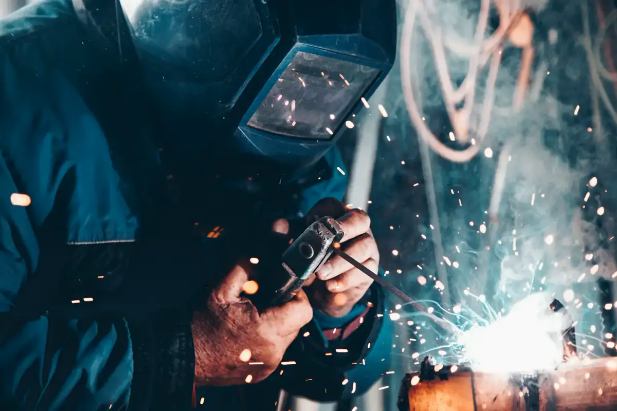 Illustrative photo of a person in a hard hat inside a steel workshop. Not Stewart and Cavalier staff.